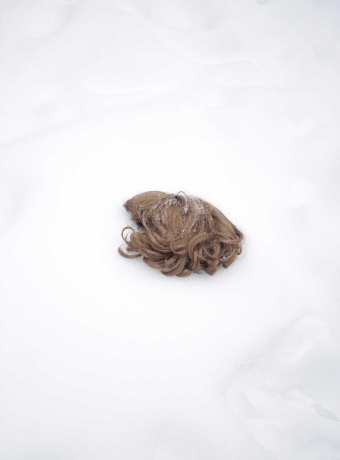<img src=“Elene Duduchava's photo untitled” alt=“woman's wig on the snow” title=“minimalist”