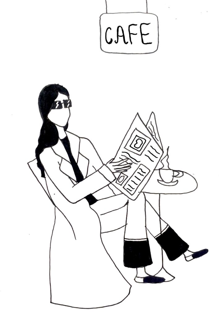 a woman in a cafe with a newsletter